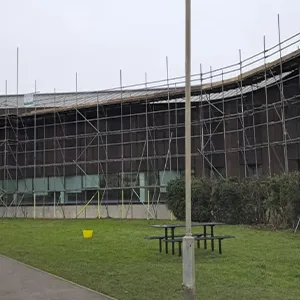 A large building with scaffolding on the side of it.